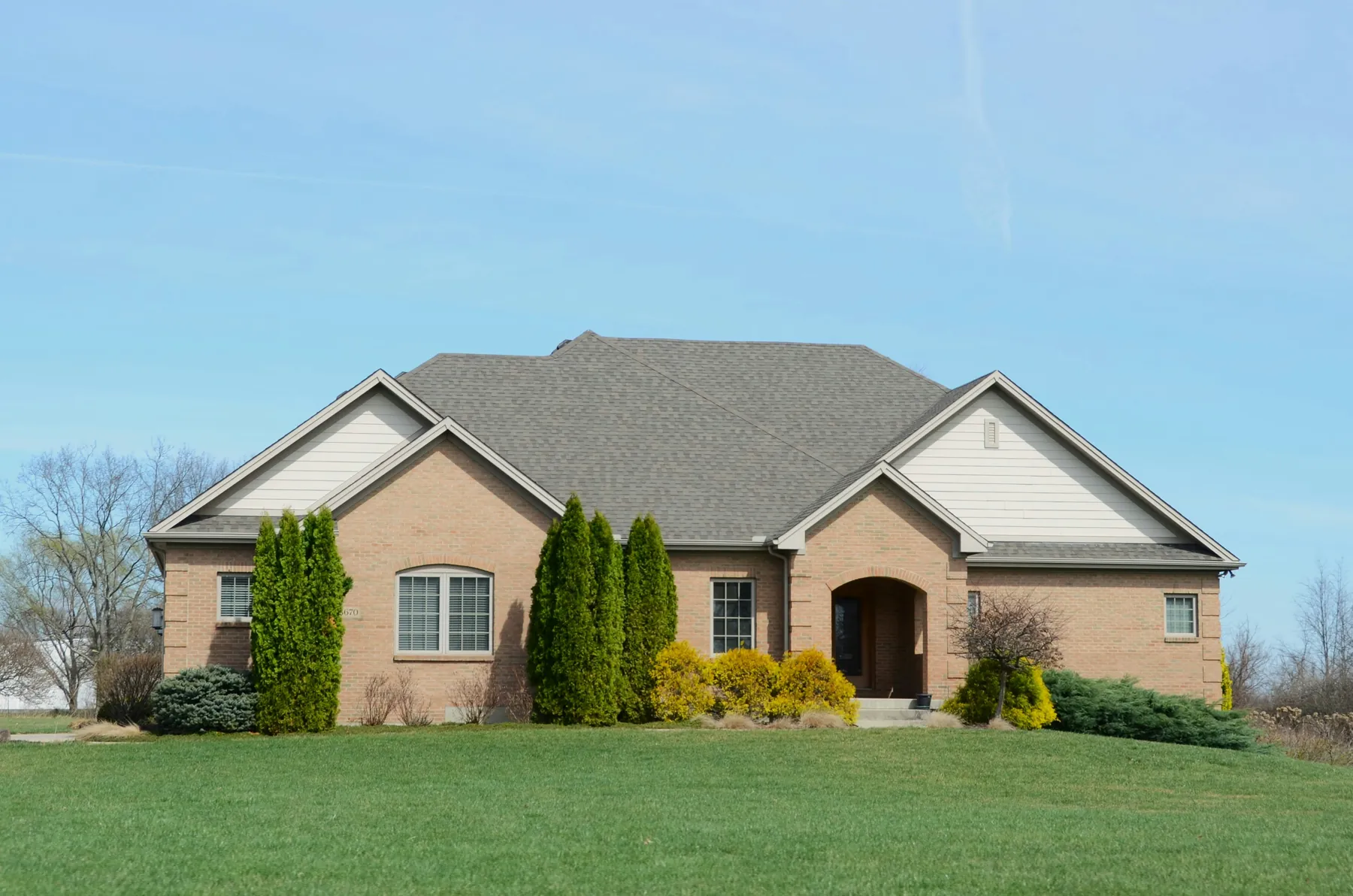 Suburban home exterior representing residential real estate